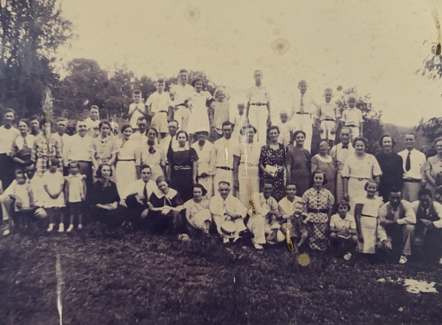 A large Tucker family reunion in a field, mid-1930s